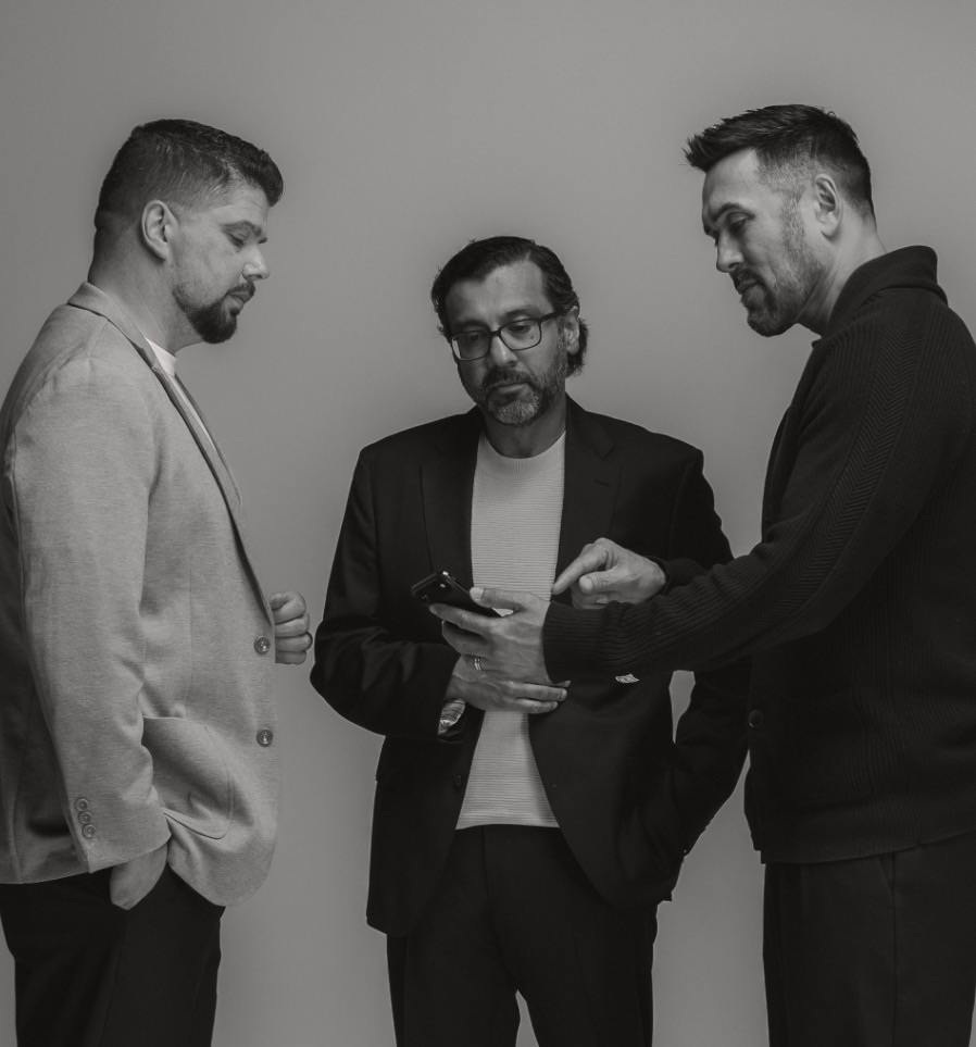 Three Renovo House operators standing in a studio